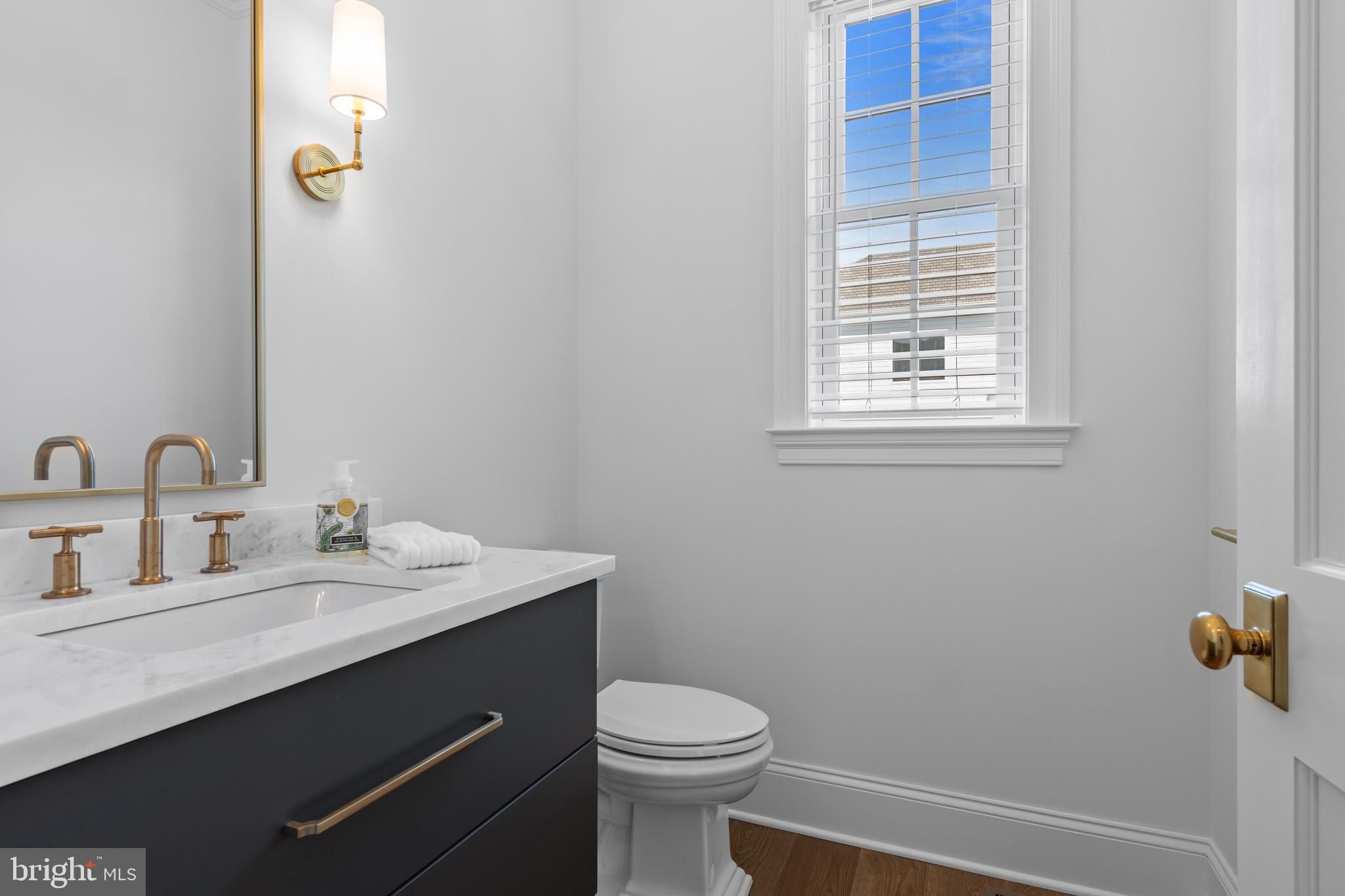 1052 Prescott Road Berwyn, PA 19312 - Photo 29 of 65 a bathroom with a sink a toilet and a mirror