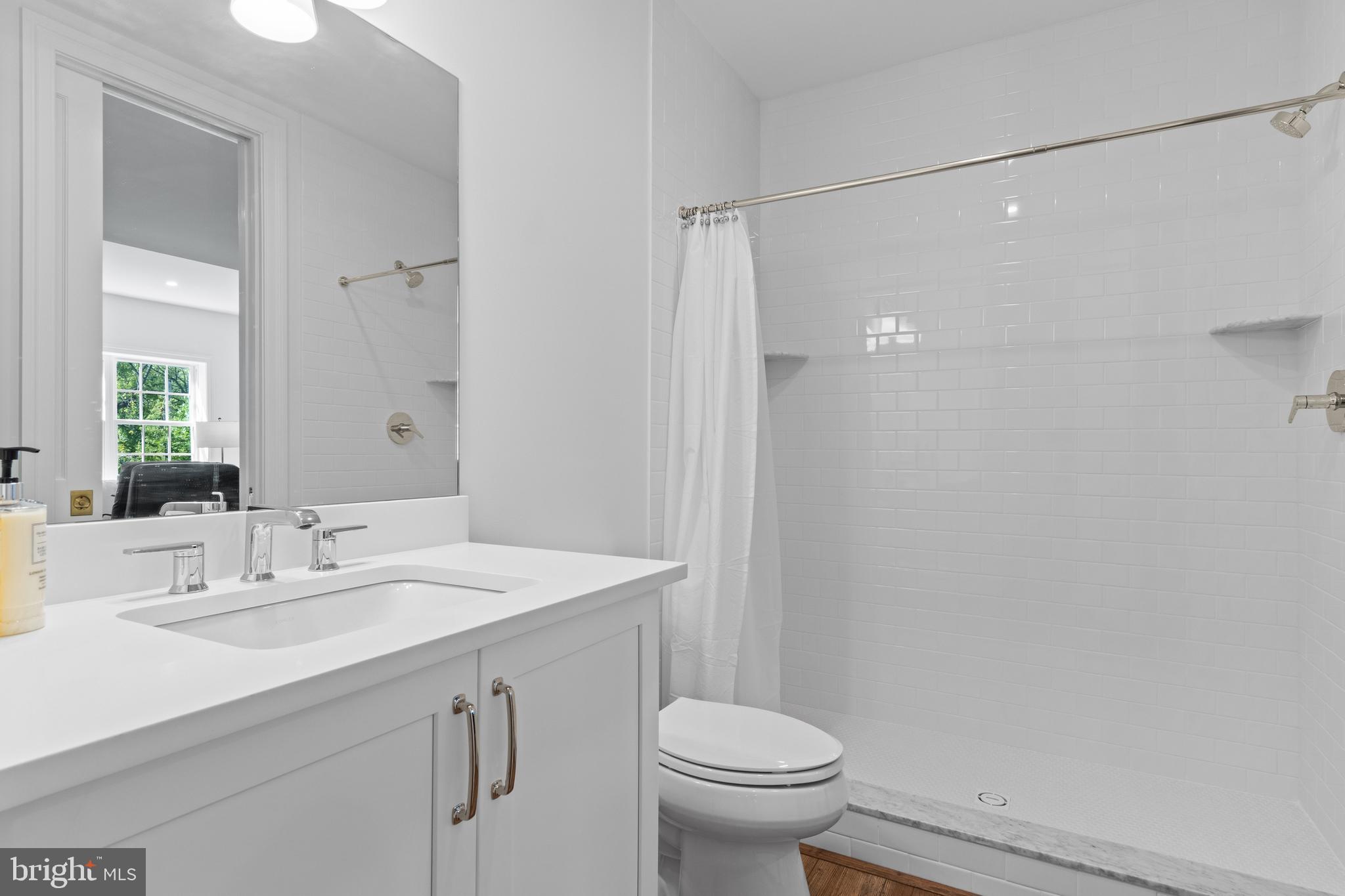 1052 Prescott Road Berwyn, PA 19312 - Photo 36 of 65 a bathroom with a sink a toilet and shower