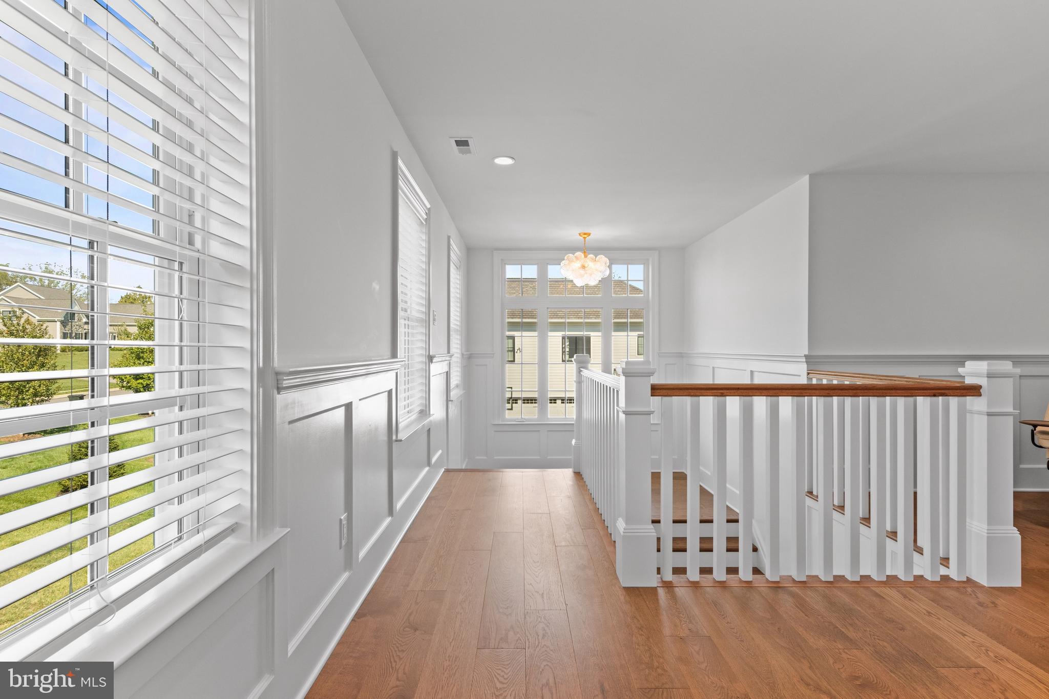 1052 Prescott Road Berwyn, PA 19312 - Photo 39 of 65 a view of a hallway with wooden floor and staircase