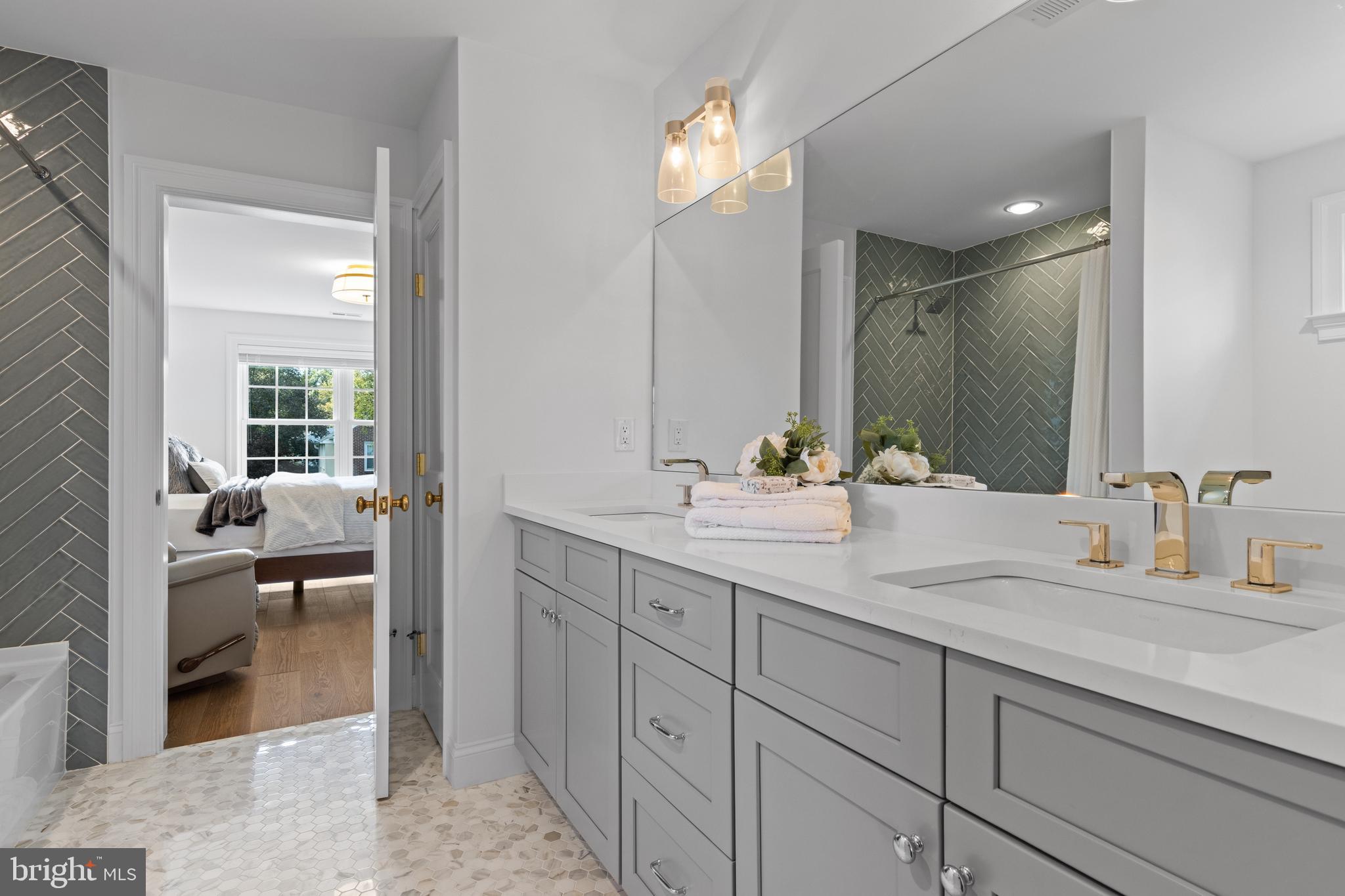 1052 Prescott Road Berwyn, PA 19312 - Photo 51 of 65 a en suite bathroom with double sink and a large mirror