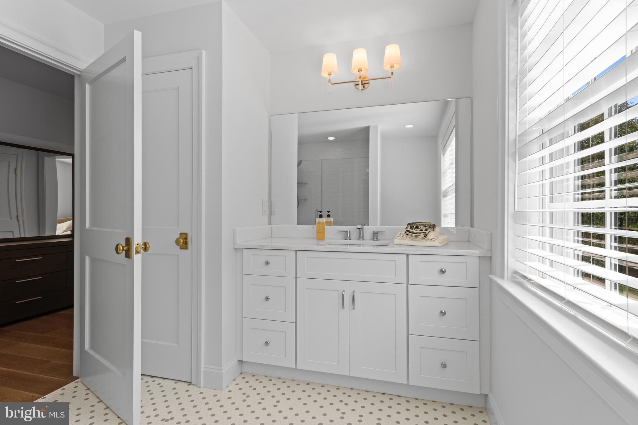 1052 Prescott Road Berwyn, PA 19312 - Photo 57 of 65 a bathroom with a sink a vanity and a mirror