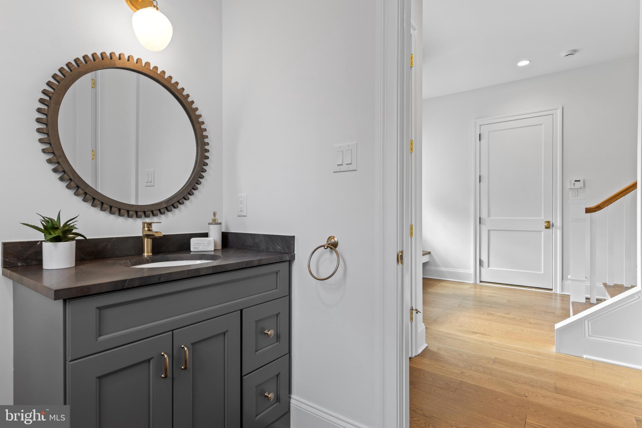1052 Prescott Road Berwyn, PA 19312 - Photo 59 of 65 a bathroom with a granite countertop sink a mirror and a shower
