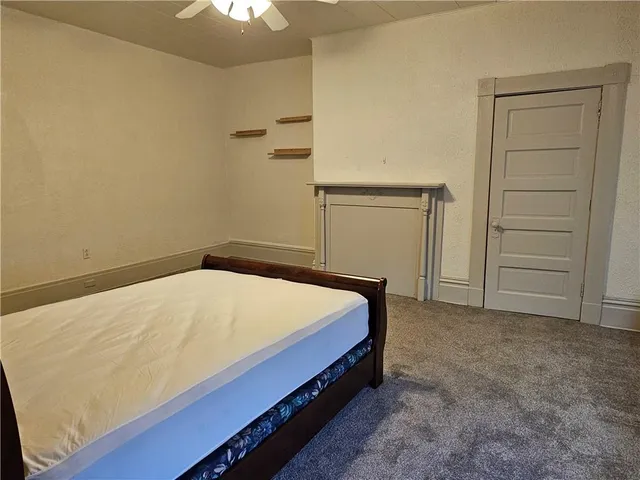 a bed sitting in a room and closet