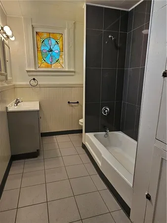 a bathroom with a tub and sink