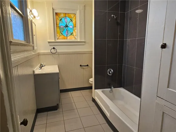 a bathroom with a sink a vanity and a mirror
