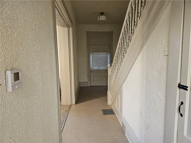 a view of a hallway with staircase
