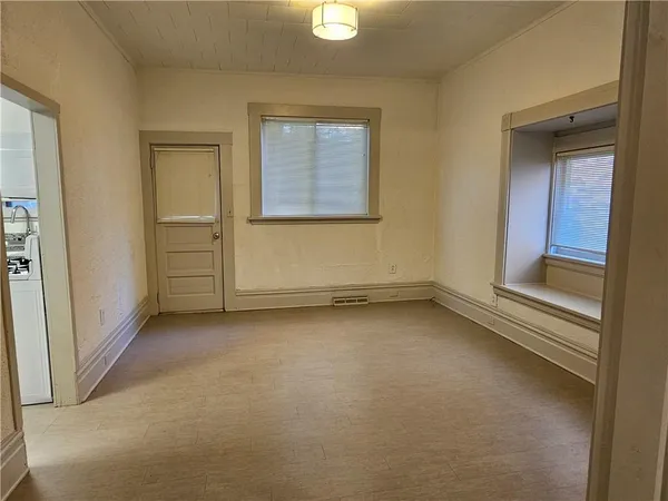 an empty room with windows