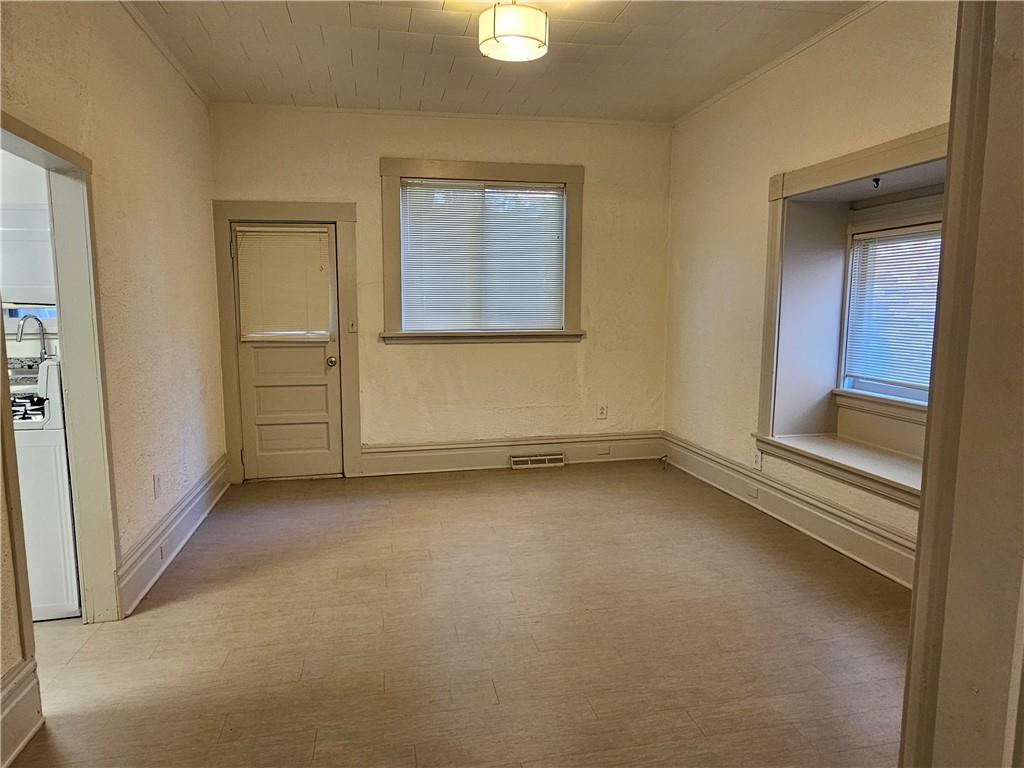 629 R Walnut Street Irwin, PA 15642 - Photo 8 of 25 an empty room with windows