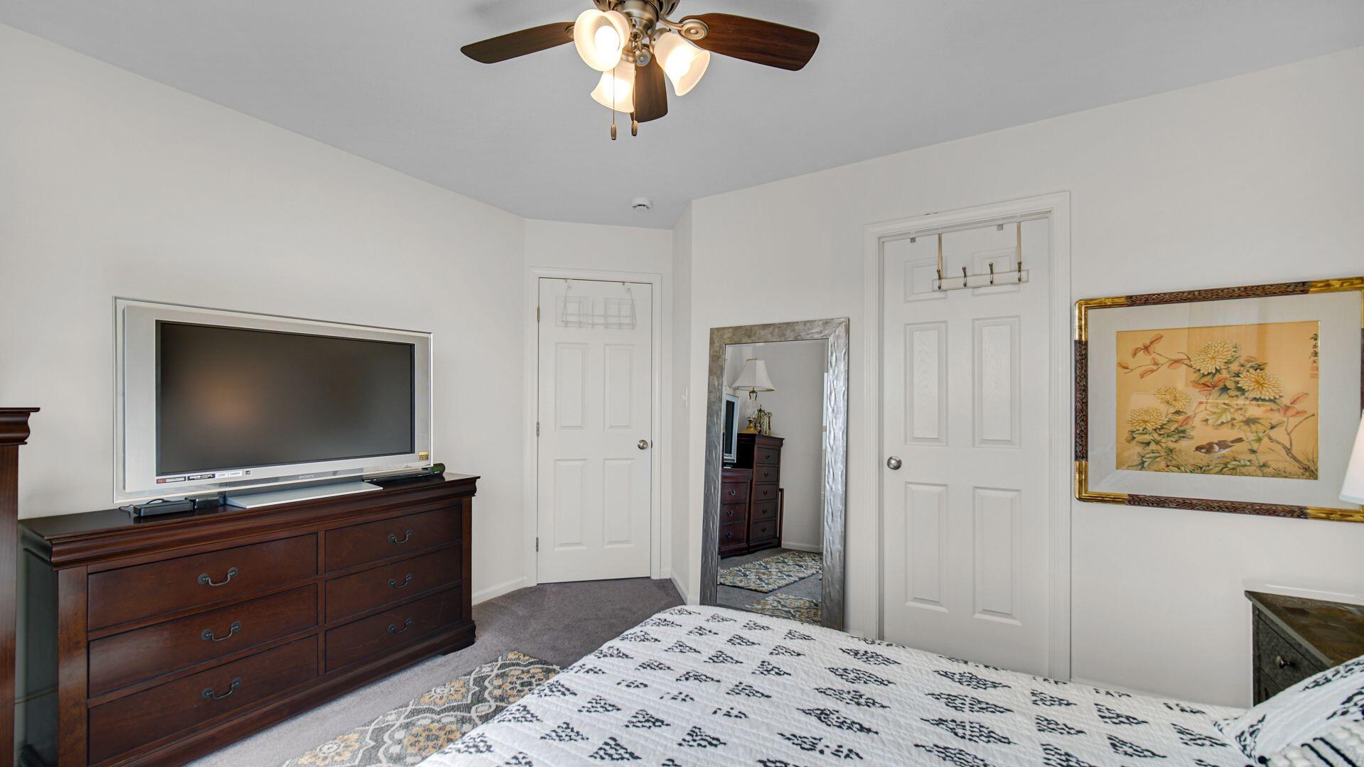 11175 Vermont Circle Crown Point, IN 46307 - Photo 13 of 22 a bedroom with a bed and a flat screen tv