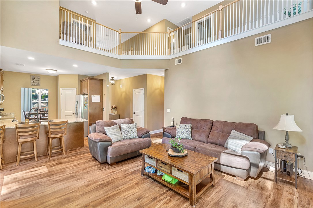 3004 Cobbs Way Anderson, SC 29621 - Photo 11 of 46 Dramatic high ceilings and a second-story overlook define this airy open-concept living space.