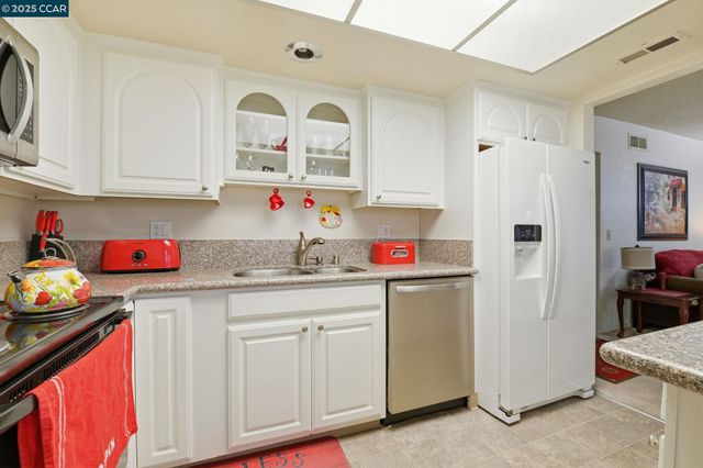 a kitchen with a stove and cabinets
