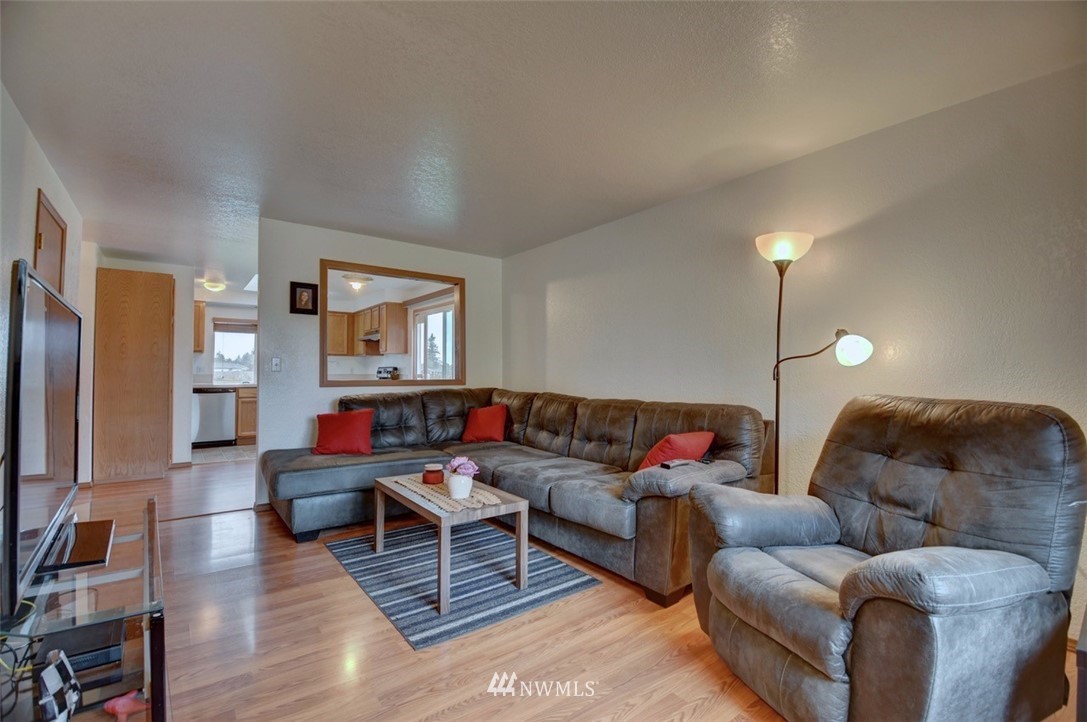 4121 Violet Court Southwest Rochester, WA 98579 - Photo 2 of 21 a living room with furniture and a flat screen tv