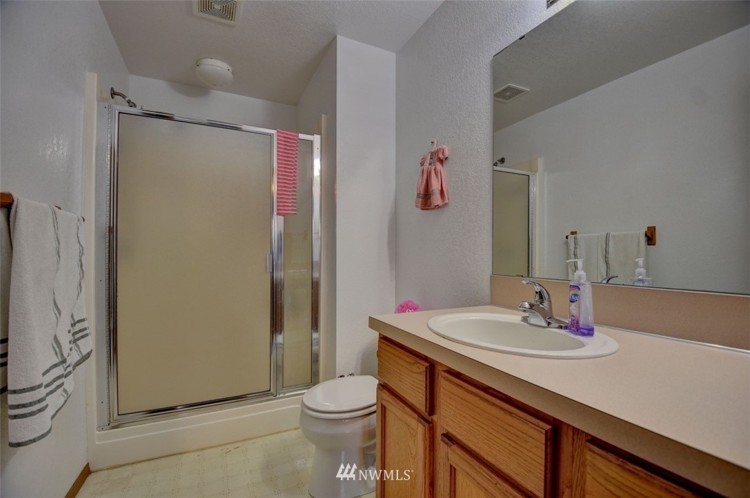 4121 Violet Court Southwest Rochester, WA 98579 - Photo 13 of 21 a bathroom with a sink toilet and shower