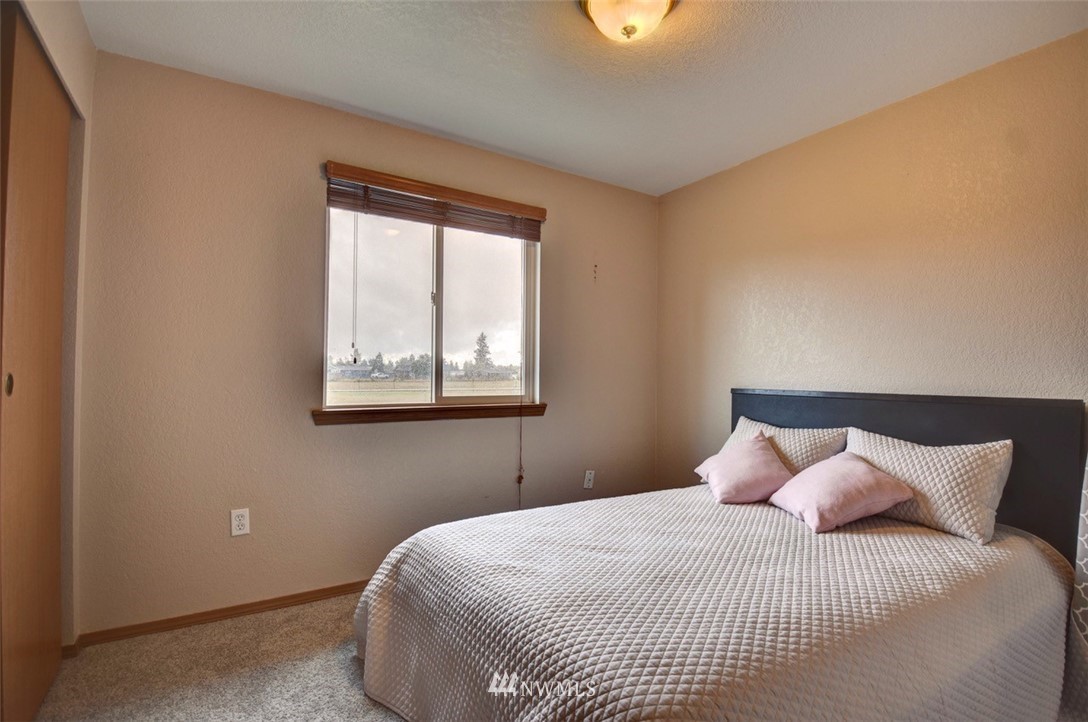 4121 Violet Court Southwest Rochester, WA 98579 - Photo 15 of 21 a bedroom with a bed and window