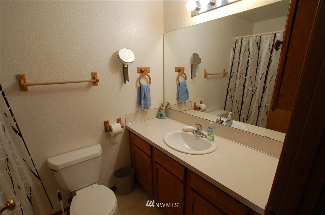 4121 Violet Court Southwest Rochester, WA 98579 - Photo 16 of 21 a bathroom with a sink toilet and shower