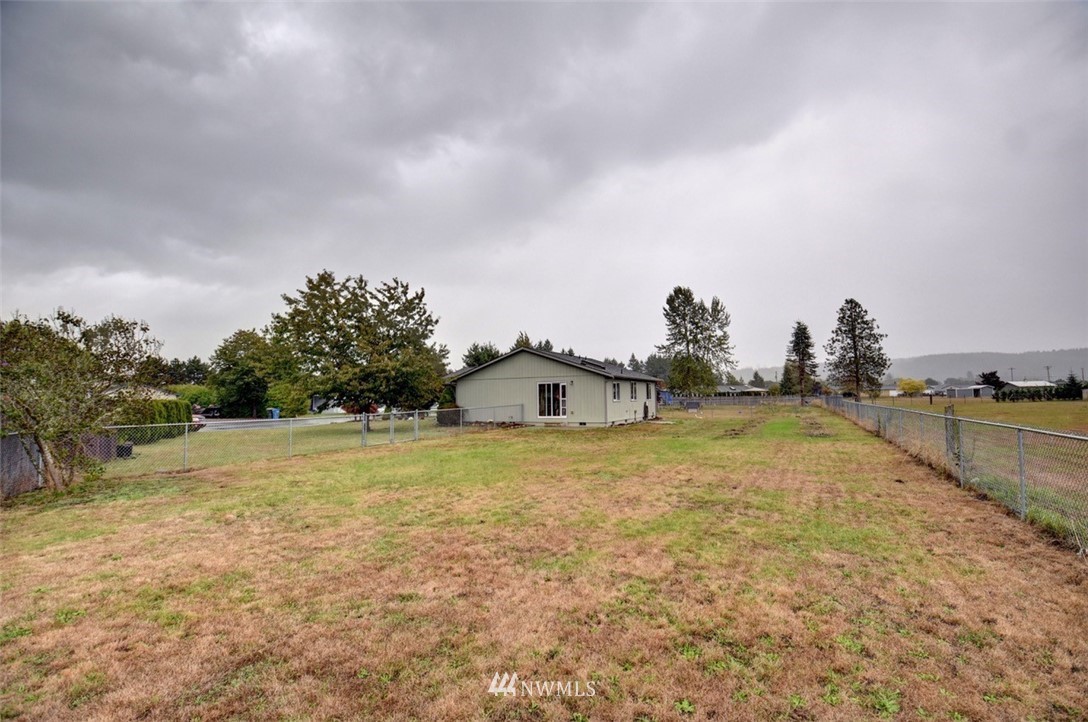 4121 Violet Court Southwest Rochester, WA 98579 - Photo 17 of 21 a view of a house with a yard and entertaining space