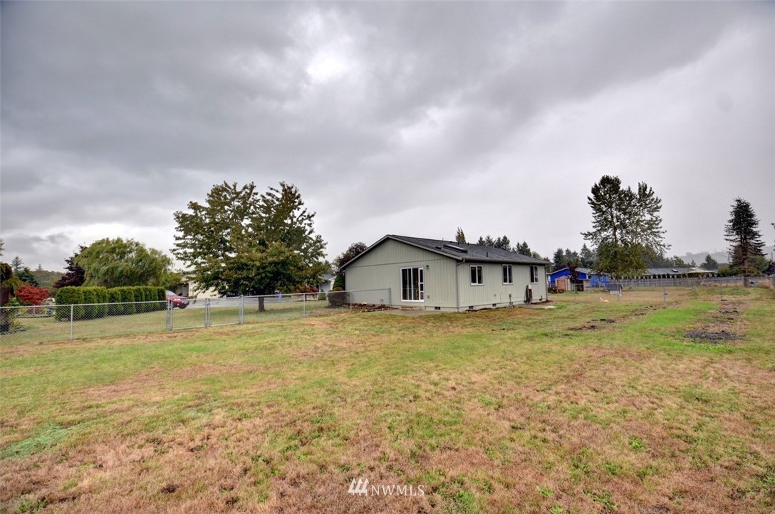 4121 Violet Court Southwest Rochester, WA 98579 - Photo 18 of 21 a view of a house with a yard and garage