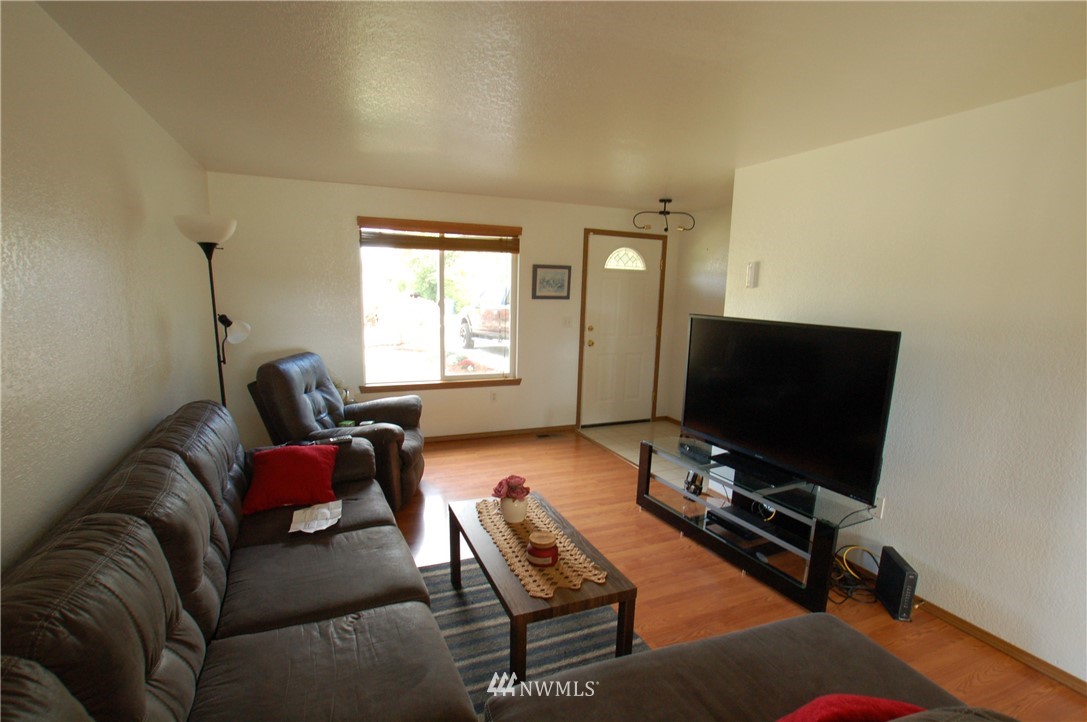 4121 Violet Court Southwest Rochester, WA 98579 - Photo 4 of 21 a living room with furniture and a flat screen tv