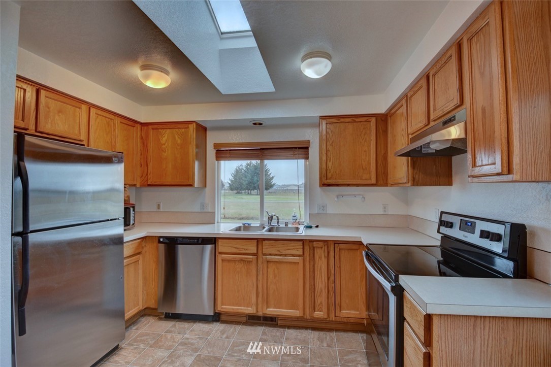 4121 Violet Court Southwest Rochester, WA 98579 - Photo 6 of 21 a kitchen with a sink appliances and cabinets