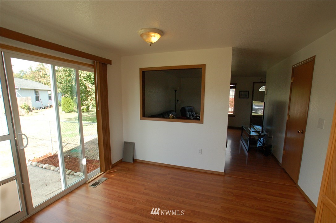 4121 Violet Court Southwest Rochester, WA 98579 - Photo 8 of 21 a view of empty room with wooden floor and fan