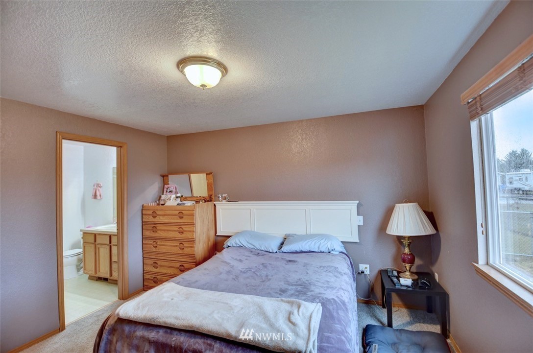 4121 Violet Court Southwest Rochester, WA 98579 - Photo 10 of 21 a bedroom with a bed and a window