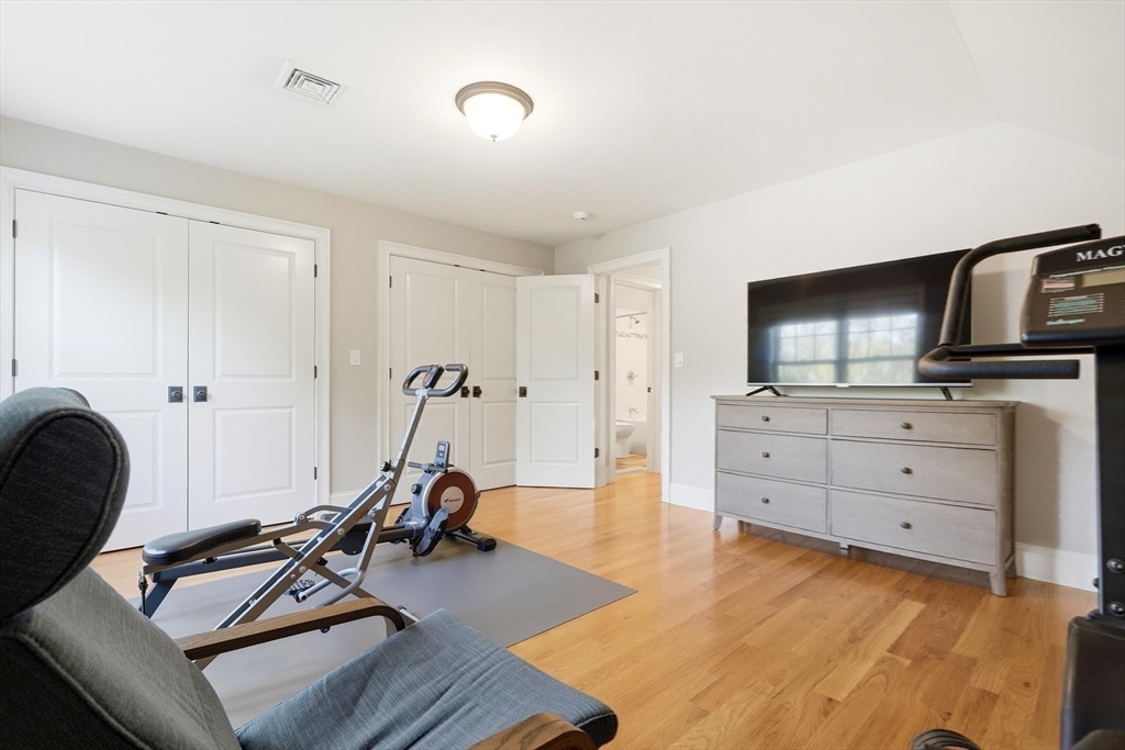 6 Flintlock Road Lexington, MA 02420 - Photo 33 of 39 a view of a workspace with furniture and gym equipment