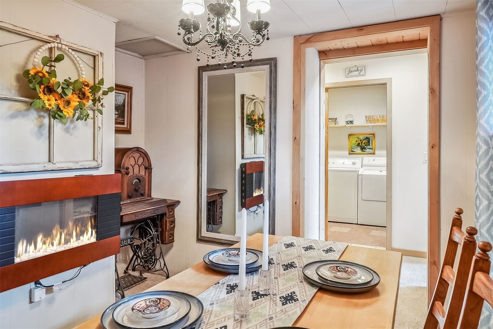 57 L Road Silverthorne, CO 80498 - Photo 24 of 38 Tiled dining area with washing machine and dryer and a chandelier