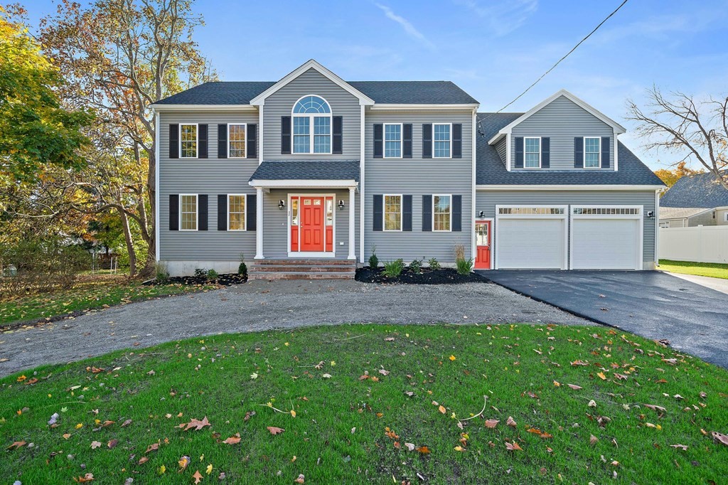 1 Northway Road Randolph, MA 02368 - Photo 1 of 40 a front view of a house with a yard and trees