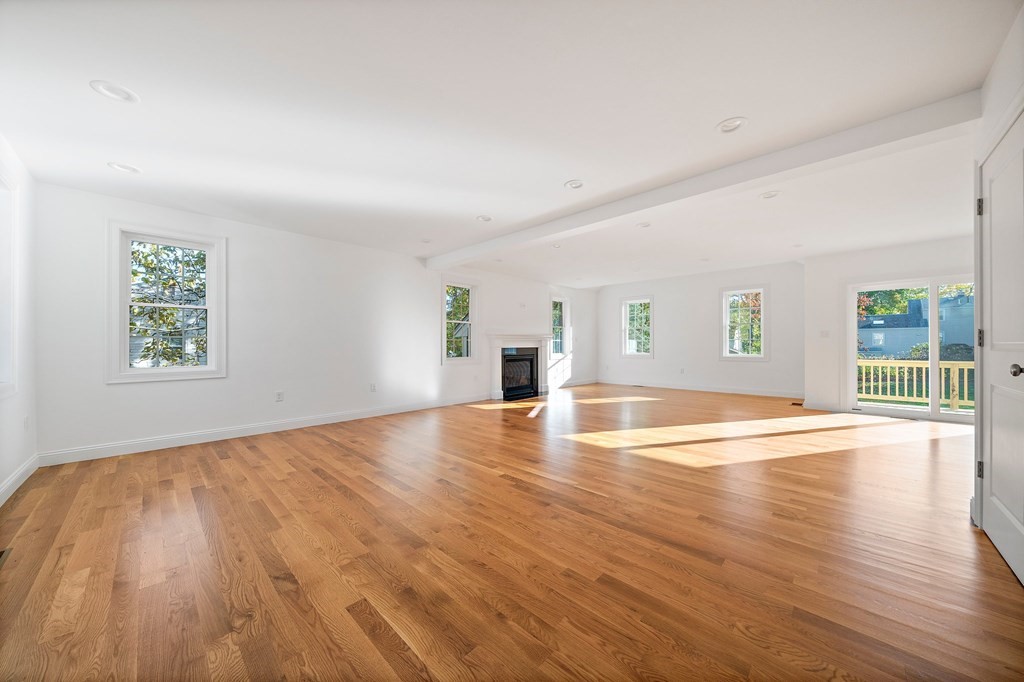 1 Northway Road Randolph, MA 02368 - Photo 13 of 40 an empty room with wooden floor and windows