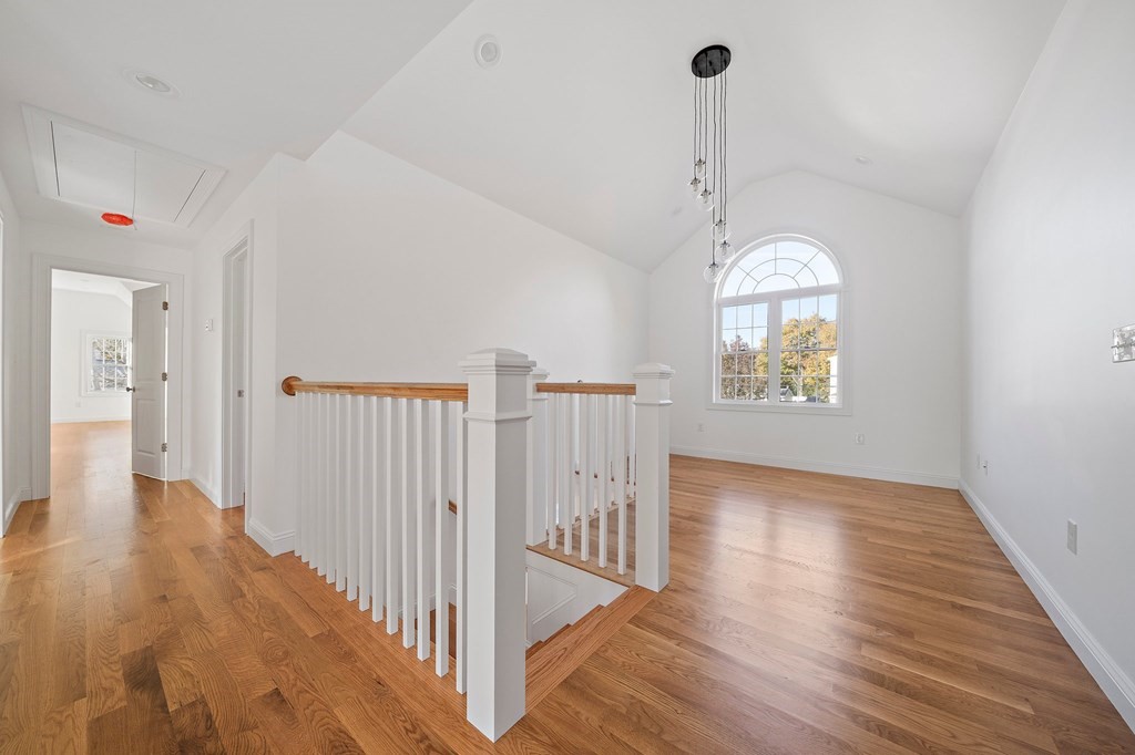 1 Northway Road Randolph, MA 02368 - Photo 18 of 40 a view of empty room with wooden floor and fan