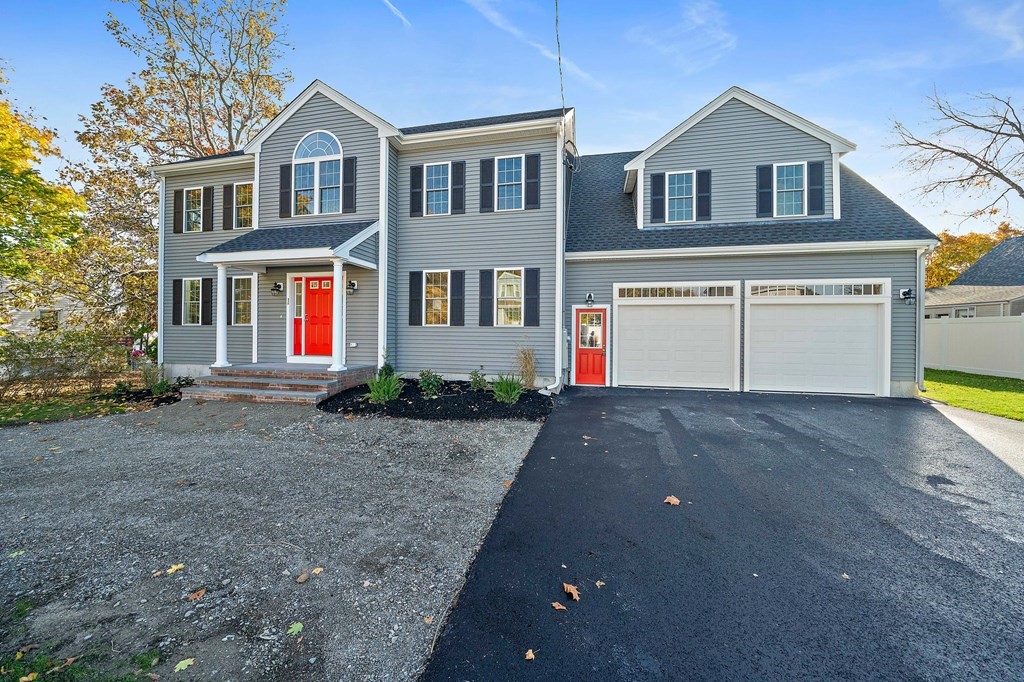 1 Northway Road Randolph, MA 02368 - Photo 2 of 40 a front view of a house with a yard and garage