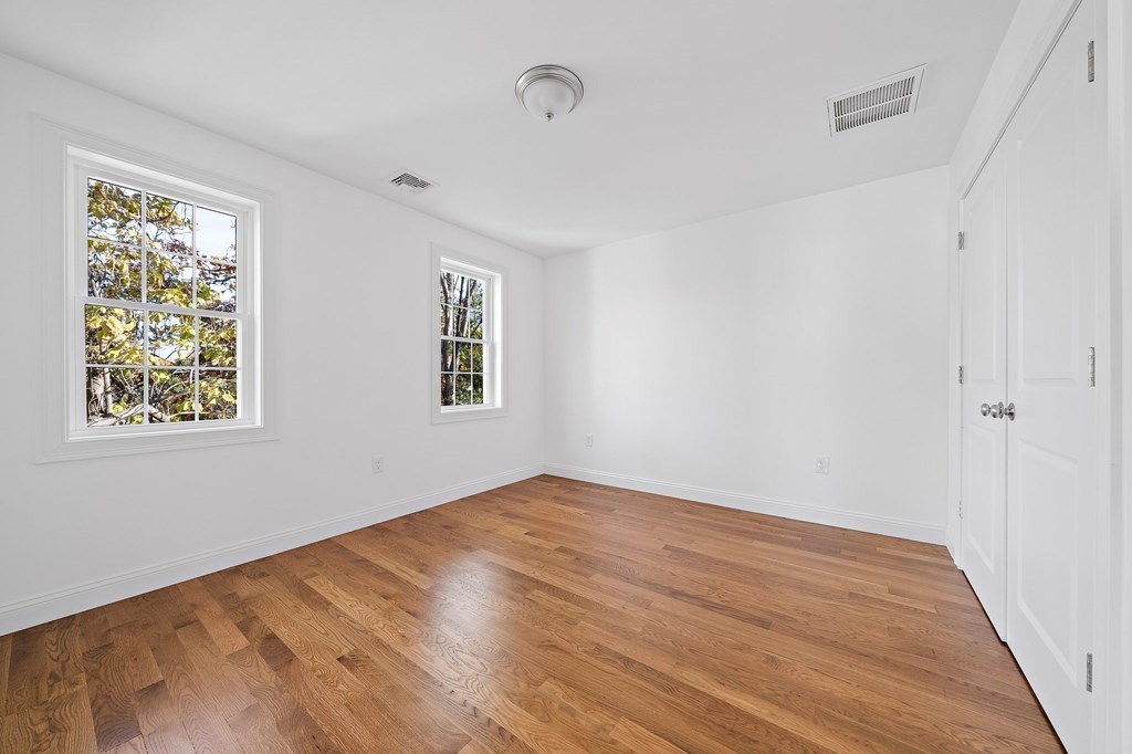 1 Northway Road Randolph, MA 02368 - Photo 21 of 40 a view of empty room with wooden floor and fan