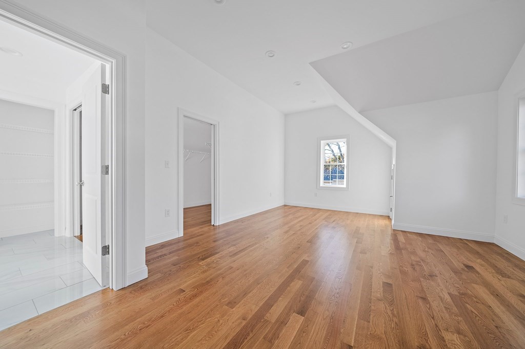 1 Northway Road Randolph, MA 02368 - Photo 26 of 40 a view of an empty room with wooden floor and a window