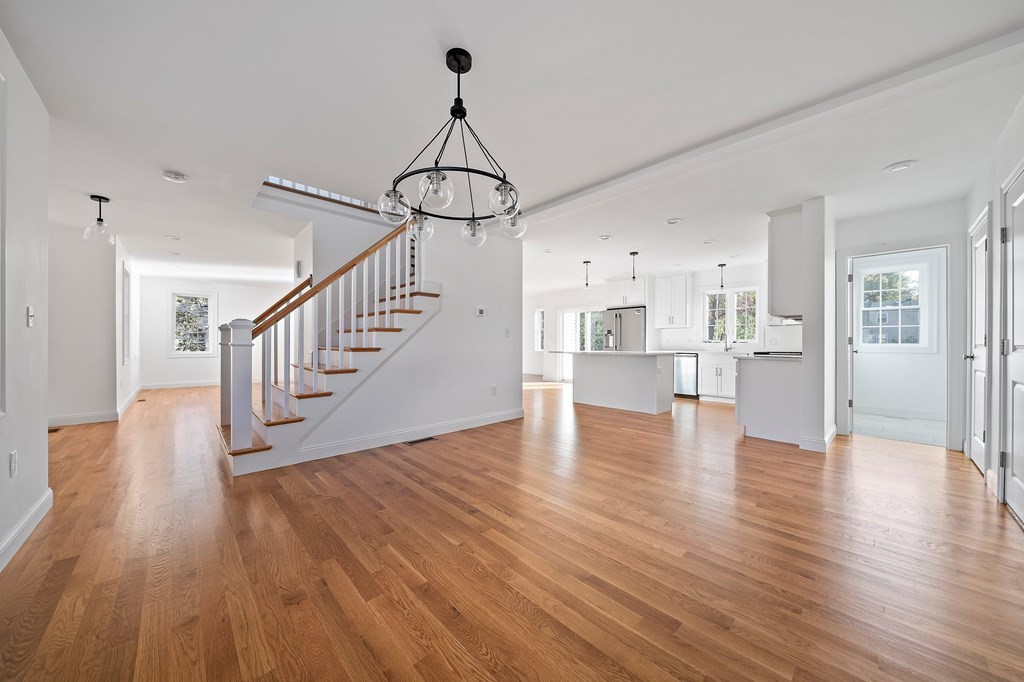 1 Northway Road Randolph, MA 02368 - Photo 4 of 40 a view of a hallway with wooden floor and staircase