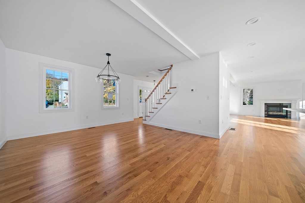 1 Northway Road Randolph, MA 02368 - Photo 5 of 40 a view of empty room with wooden floor and window