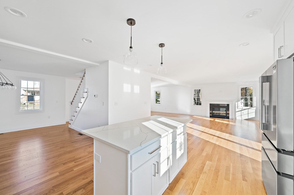 1 Northway Road Randolph, MA 02368 - Photo 9 of 40 a view of a kitchen with furniture and wooden floor