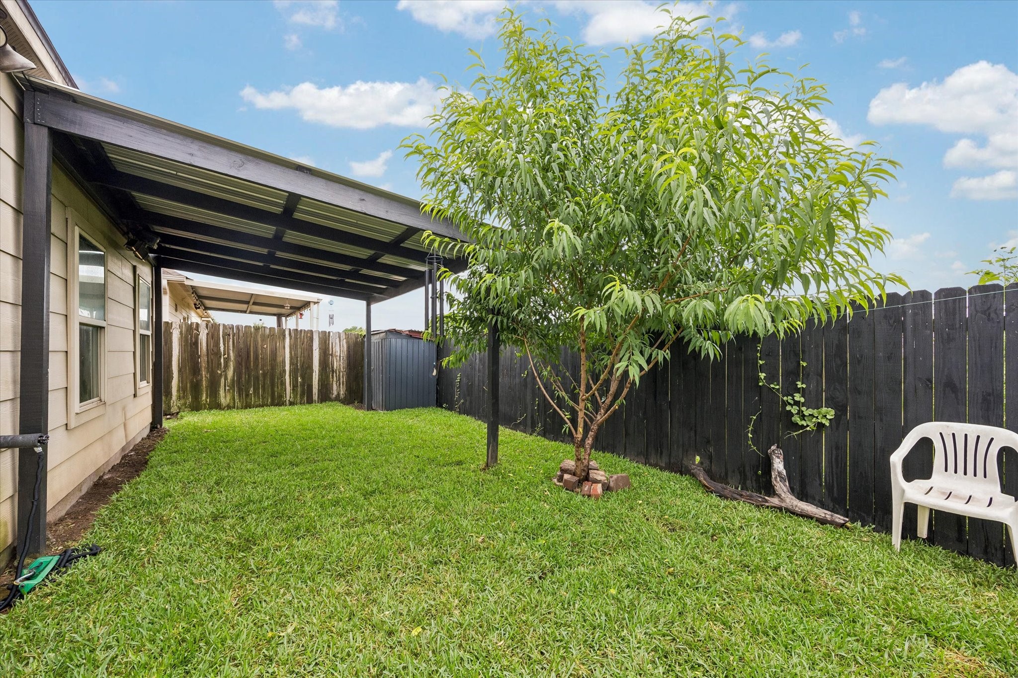 1741 Eagle Lake Road Sealy, TX 77474 - Photo 14 of 15 a backyard of a house with lots of green space