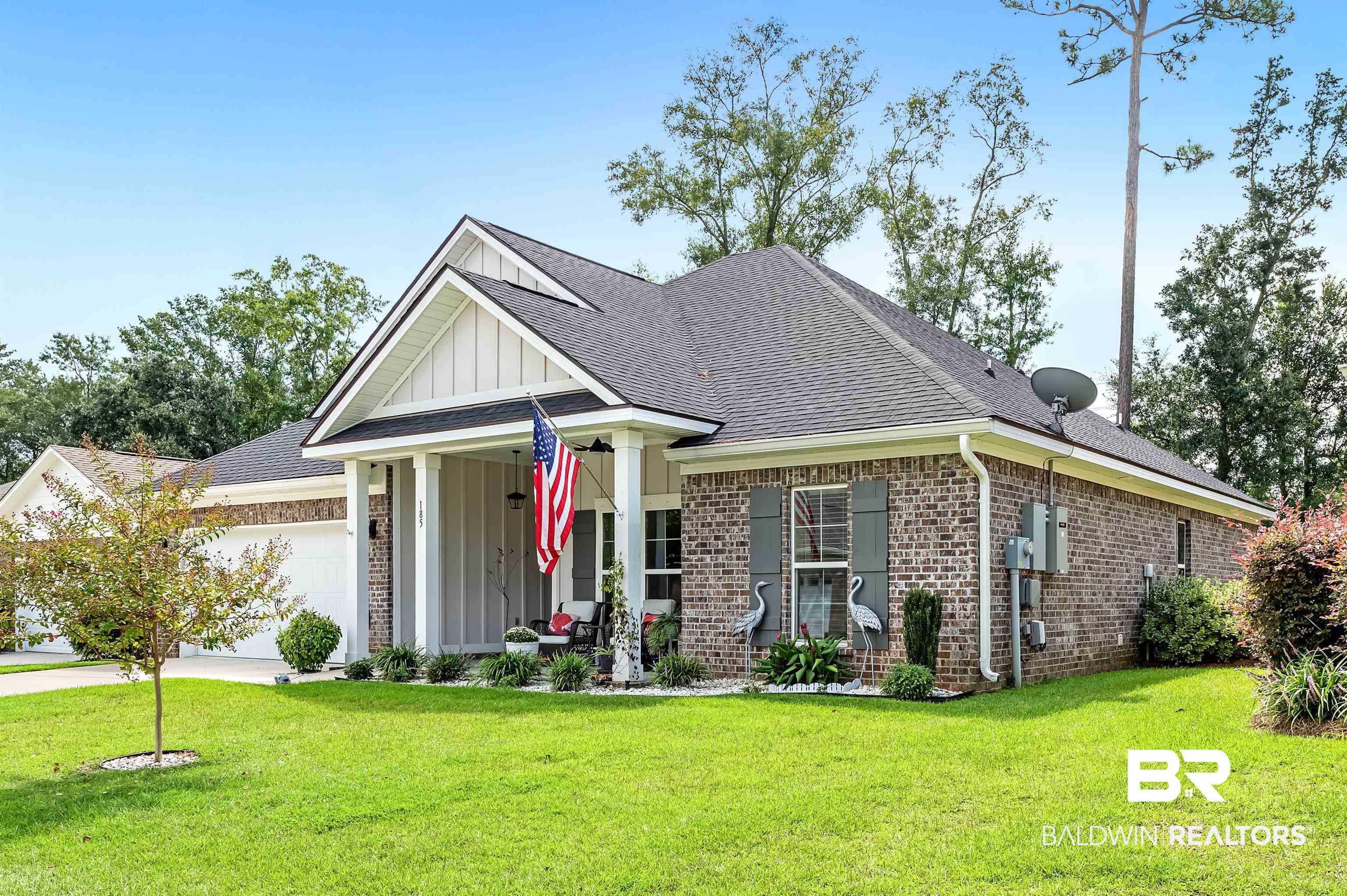 185 Mark Twain Loop Foley, AL 36535 - Photo 2 of 54 View of front of house featuring a garage and a front lawn