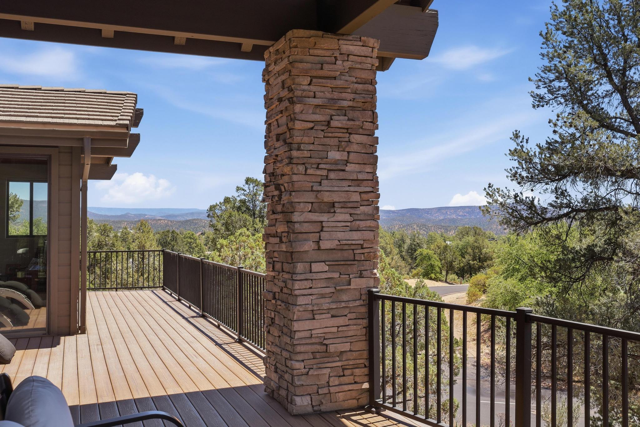 2908 East Rim Club Drive Payson, AZ 85541 - Photo 58 of 77 a view of a balcony with wooden floor and fence