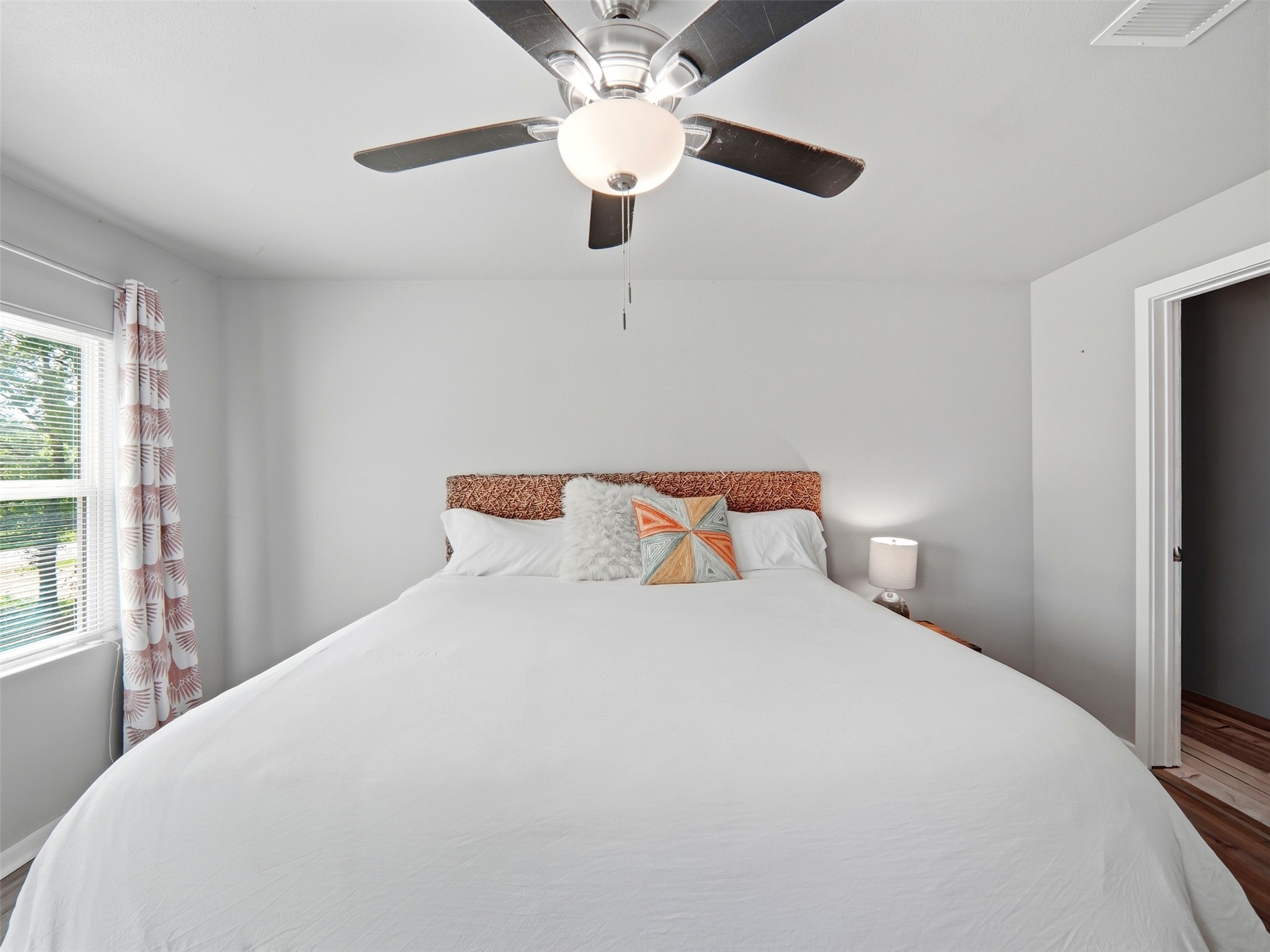 700 9th Street Blanco, TX 78606 - Photo 19 of 33 a large bed sitting in a bedroom next to a window