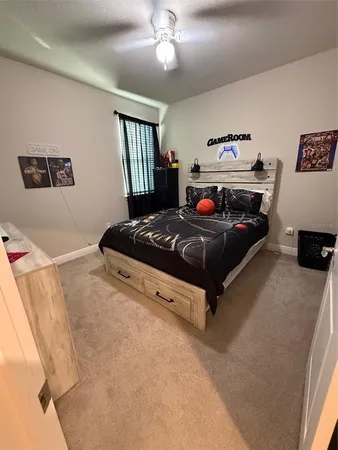 a bedroom with a bed and window