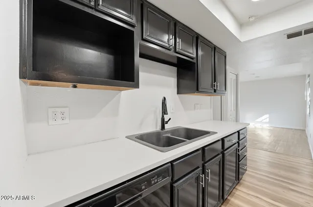 a kitchen with a sink and a microwave