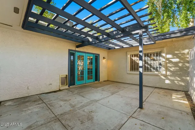 a view of porch with a table and a chandelier
