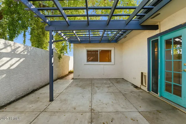 a house view with swimming pool in front of it
