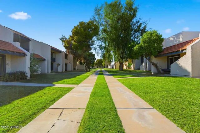 an aerial view of residential houses with city view