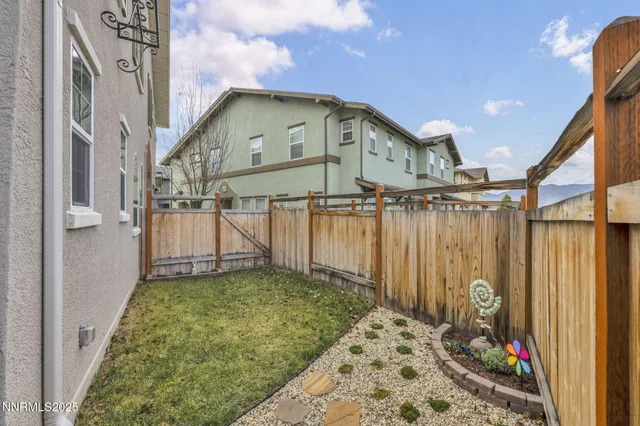 an aerial view of residential building with outdoor space and ocean view