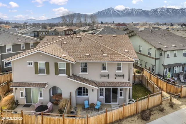 a view of a dining room with furniture wooden floor and chandelier