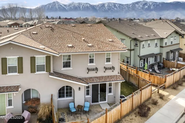 a view of a dining room with furniture chandelier and wooden floor