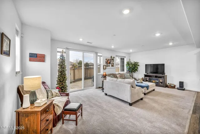a kitchen with furniture and wooden floor