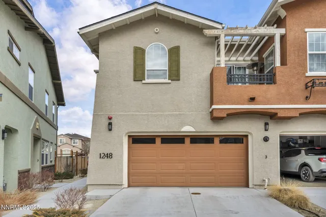 a front view of a house with parking